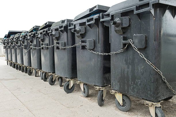tethered waste container in a row